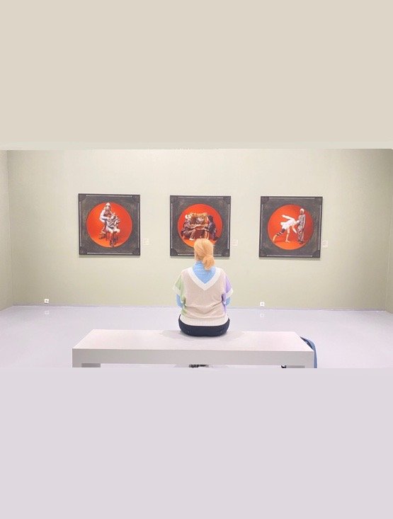 MAAM Museum House gallery view with a visitor